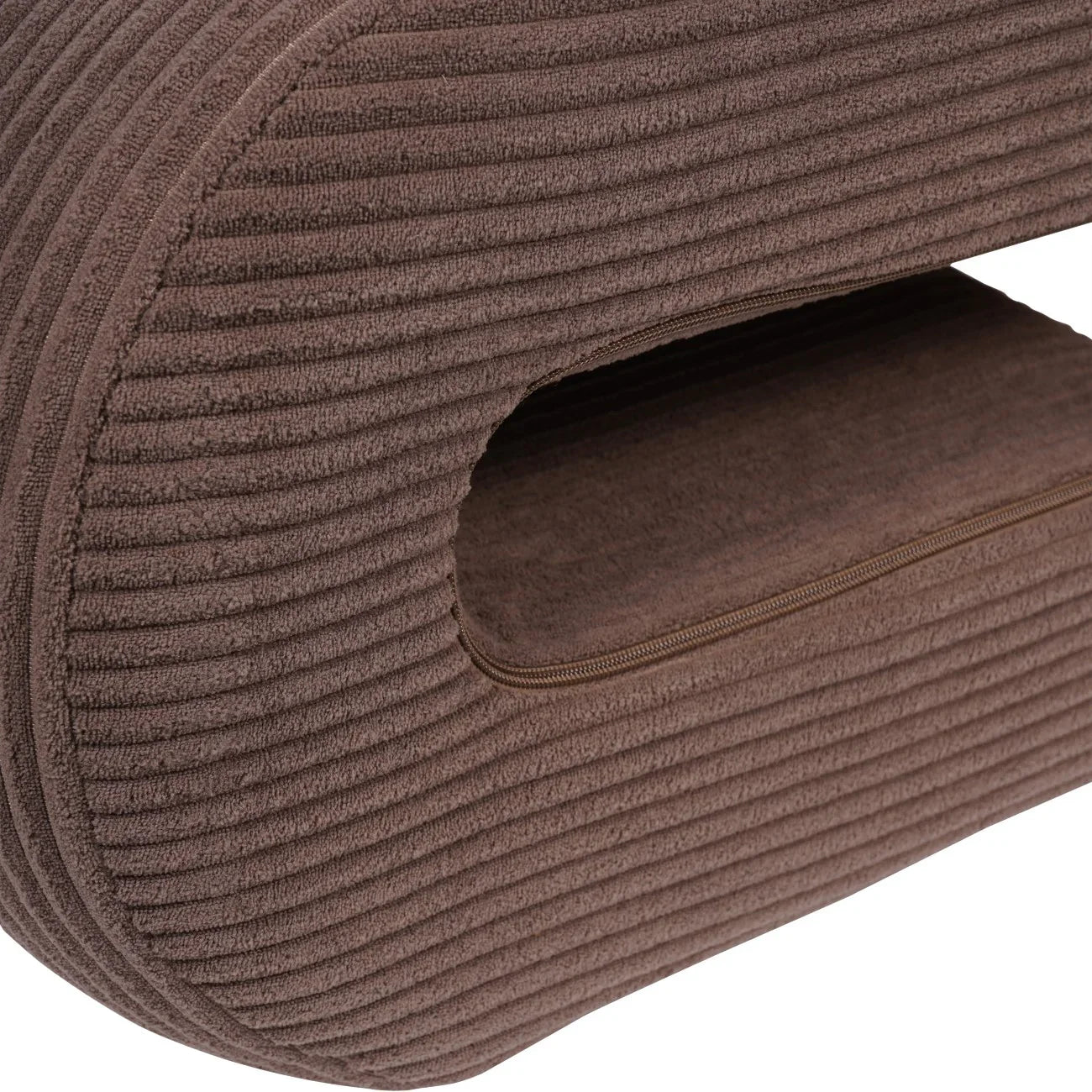 Mid brown corduroy chair detail with ribbed texture and zipper.