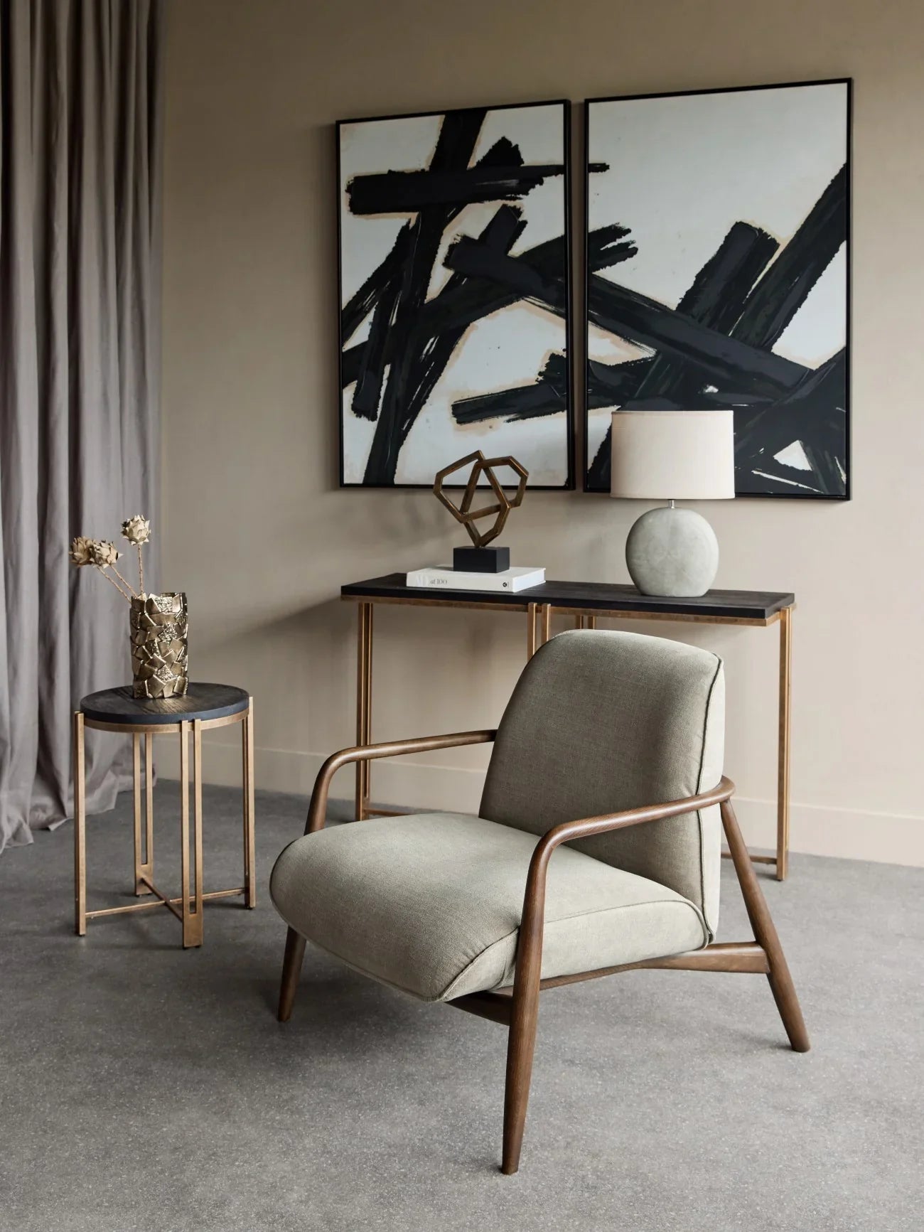 Green fabric chair with wooden arms in modern living room setting.
