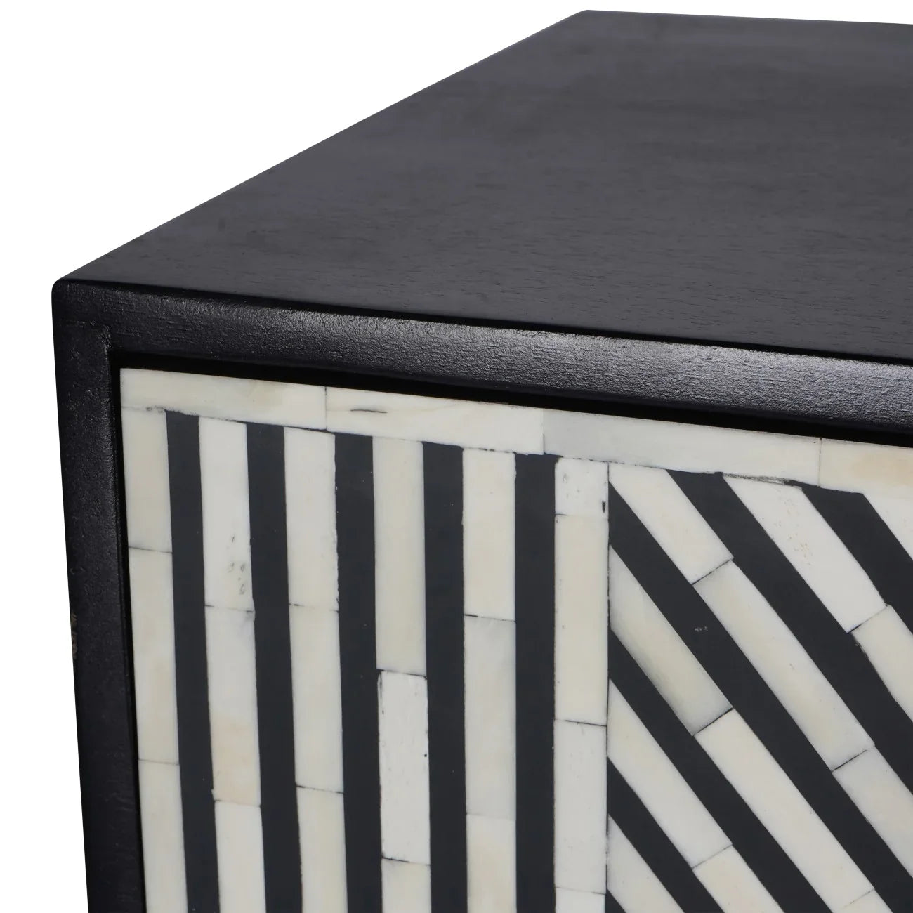 Black and white geometric pattern on cabinet corner detail.