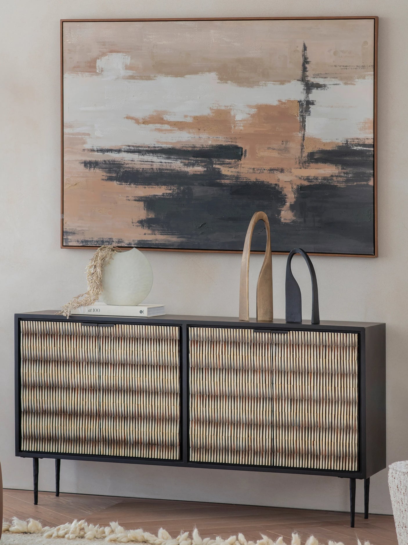 Striped bone inlay sideboard with decor in a modern living room setting.