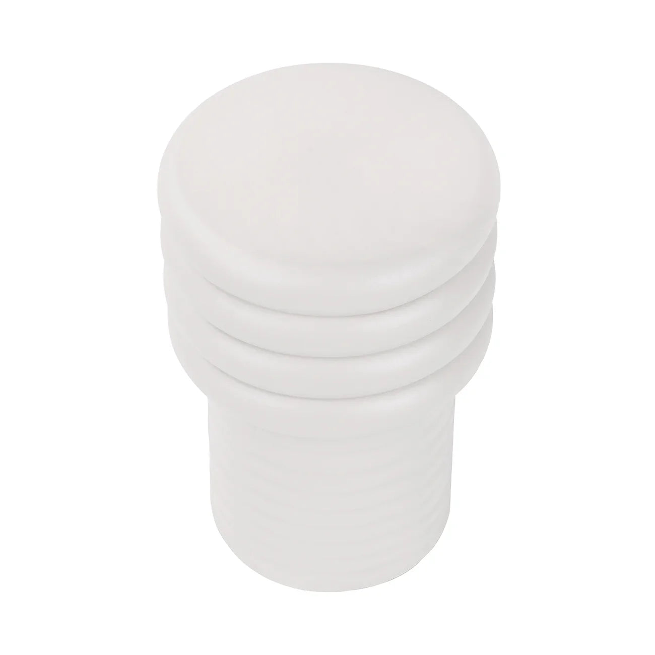 White round side table with stacked, ribbed design.