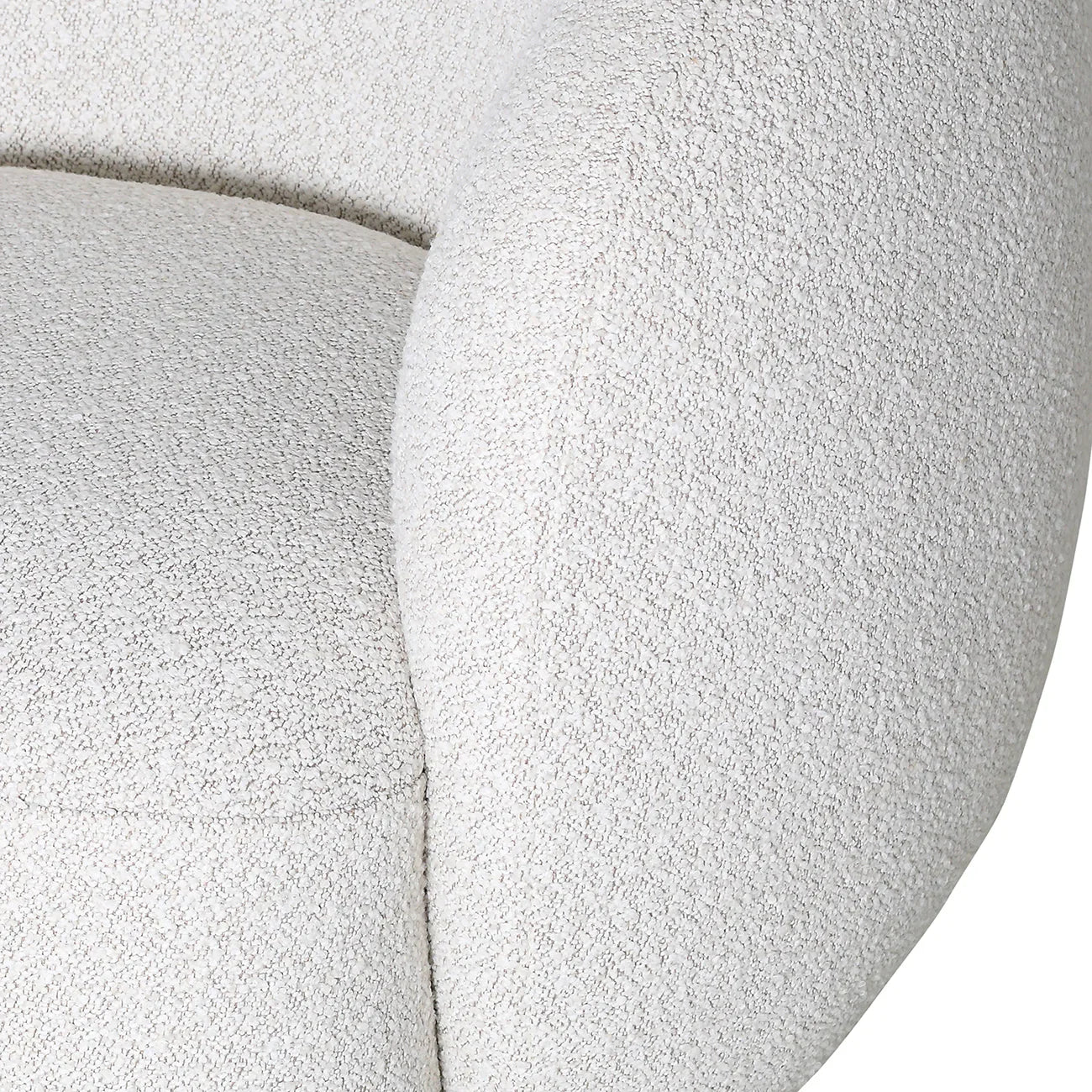 Cream swivel chair close-up showing textured upholstery detail.