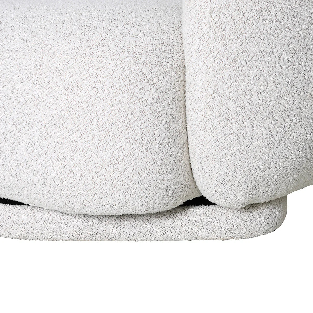 Cream boucle chair detail with soft, textured upholstery.