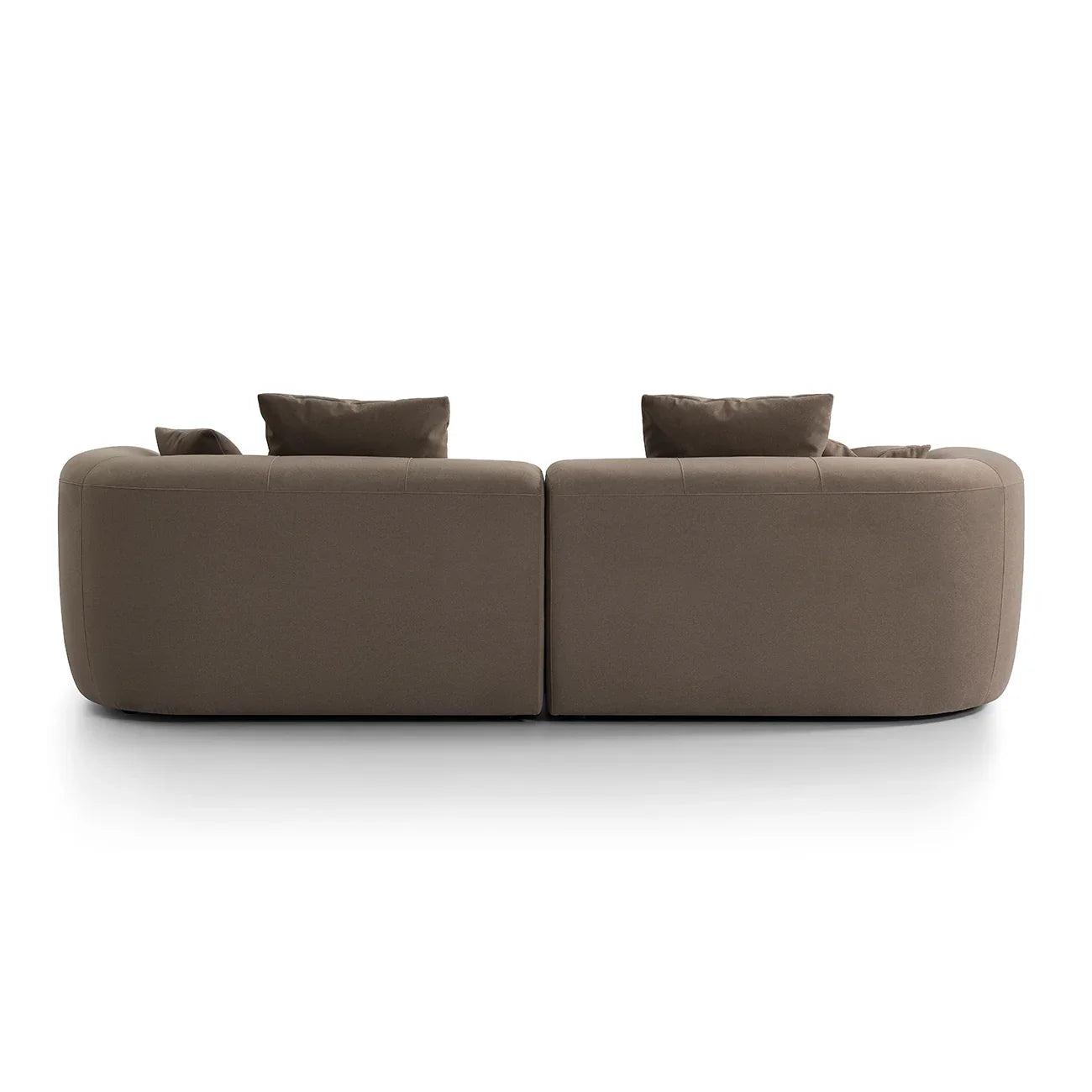 Back view of a brown velvet sofa with plush cushions.