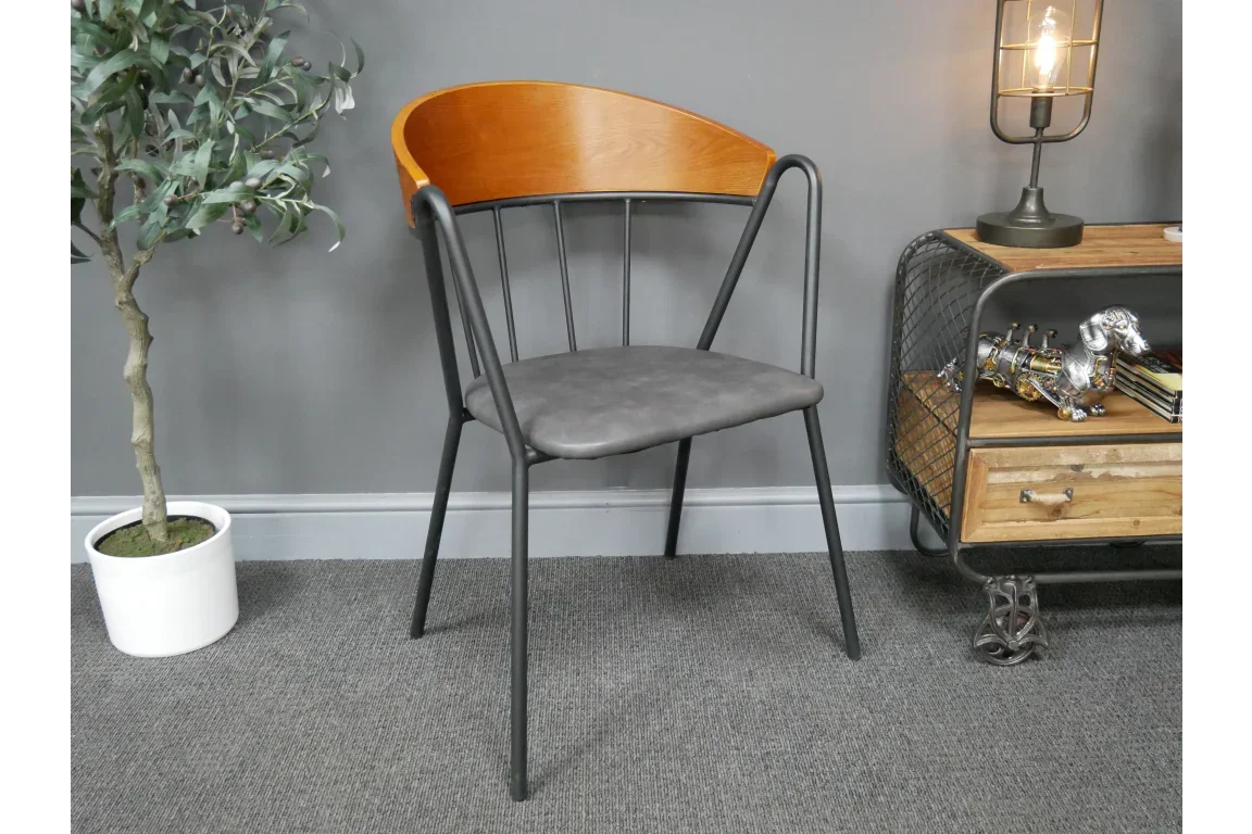 Modern dining chair with black metal frame, grey seat and curved wood backrest
