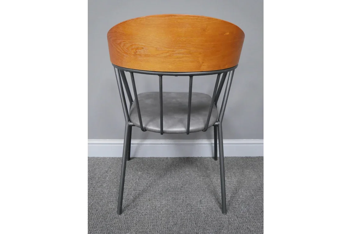 Modern dining chair with wooden curved back, metal frame and grey upholstered seat, rear view