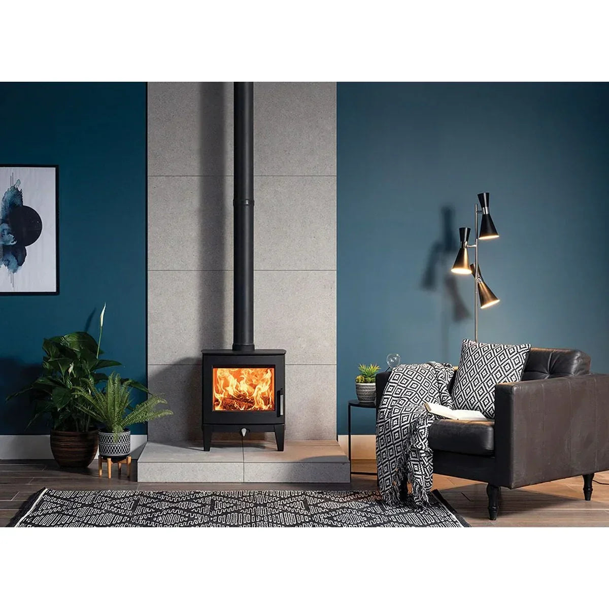 modern black wood burning stove in living room with blue walls and patterned rug