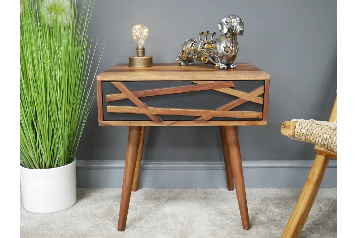 Modern wooden side table with geometric drawer front and angled legs in living room