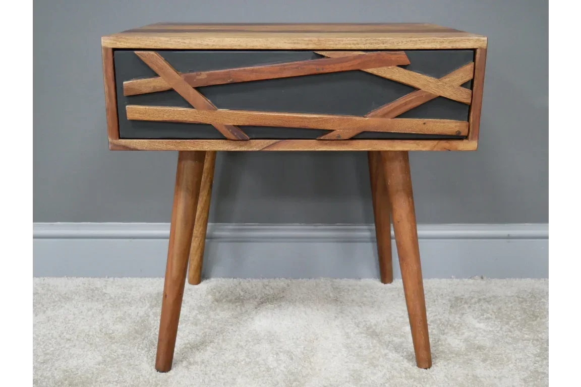 Wooden bedside table with angled legs and geometric drawer front design
