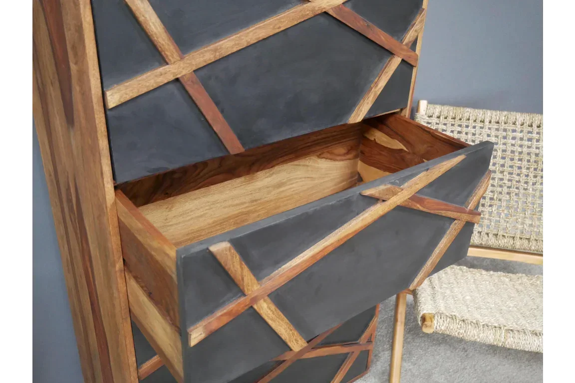Modern wood chest of drawers with black geometric front, one drawer open showing interior