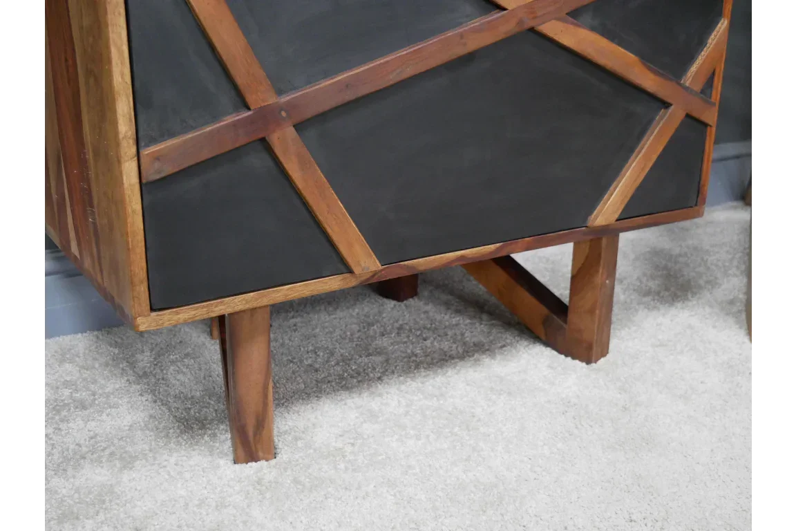 Geometric wood and black panel sideboard corner on carpeted floor