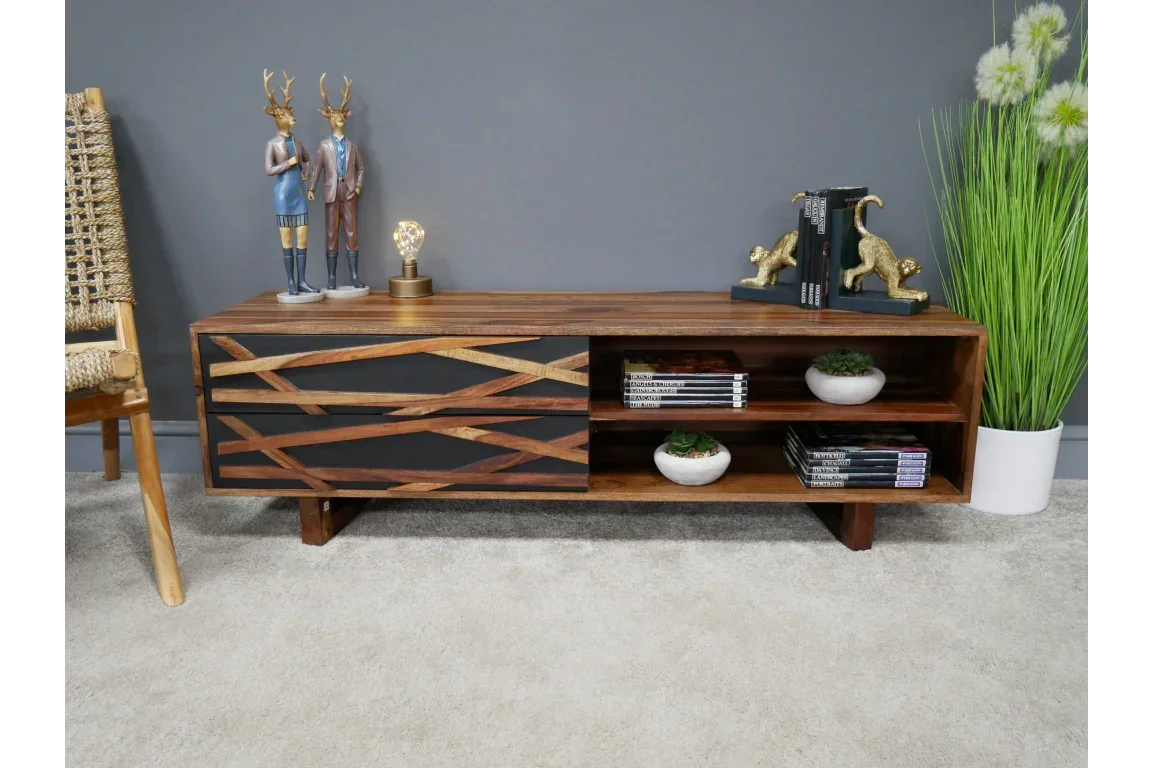 Modern wooden TV unit with geometric panel, open shelving, and decorative items on top
