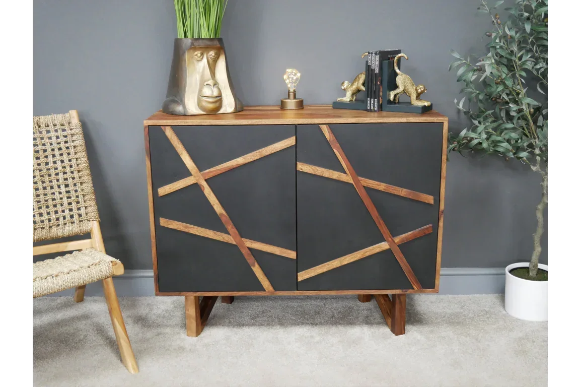 Modern sideboard cabinet with black doors and angled wooden inlay in contemporary room
