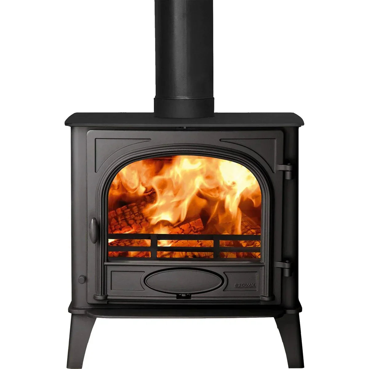 Black cast iron wood burning stove with glass door showing lit firewood flames