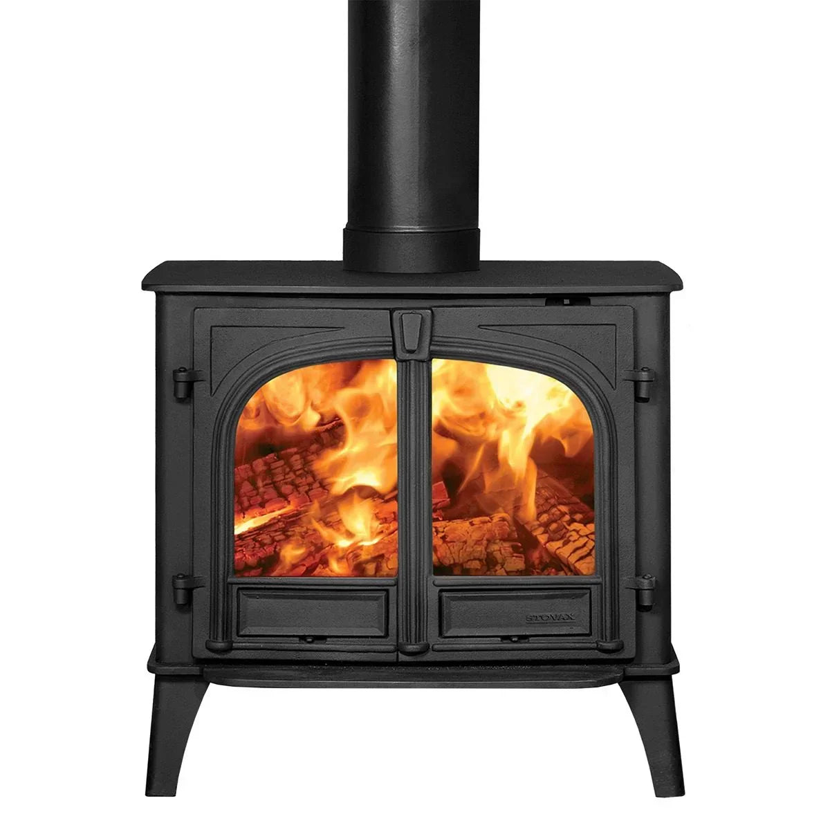 Black cast iron wood burning stove with twin glass doors and visible flames inside