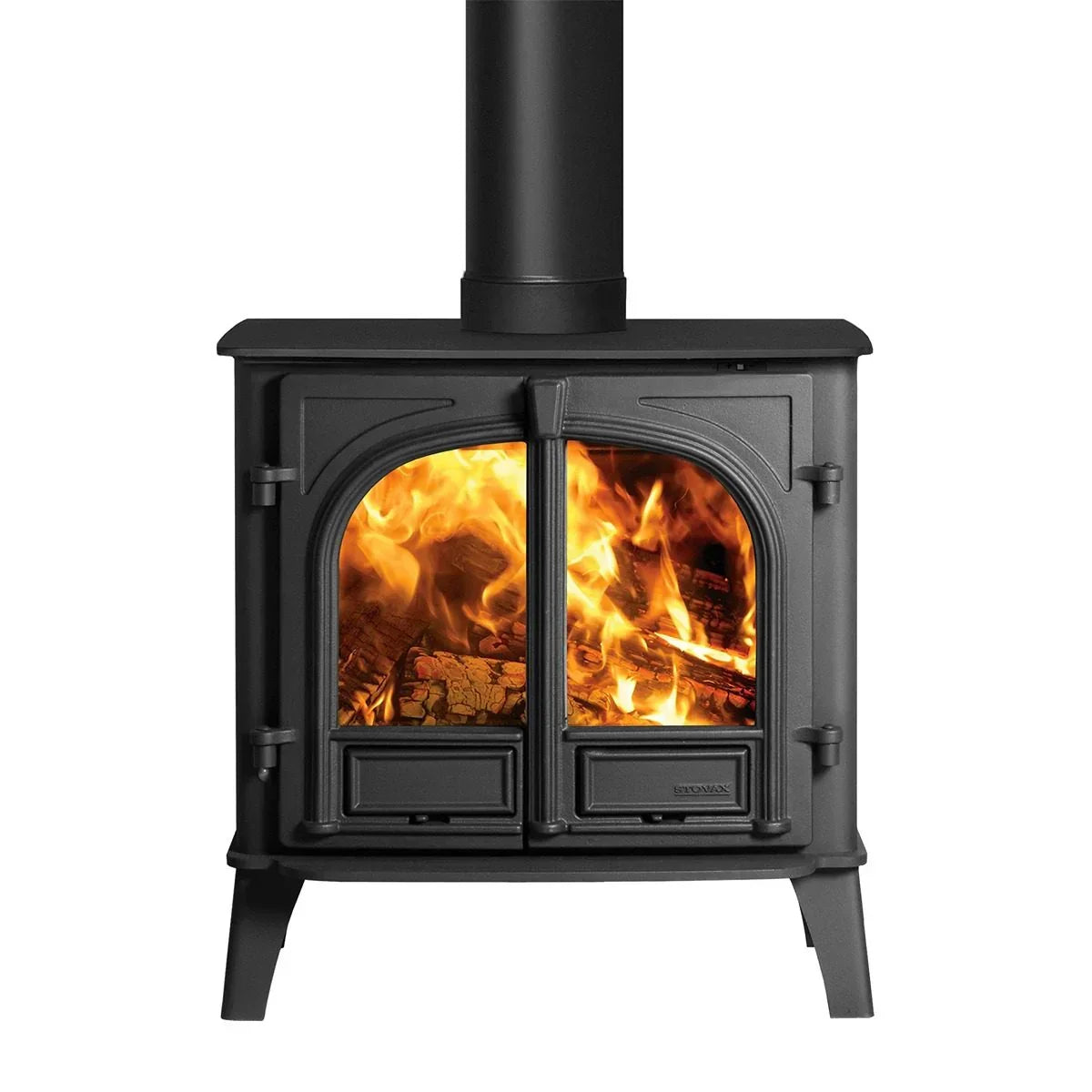 Black cast iron wood burning stove with glass doors and visible flames
