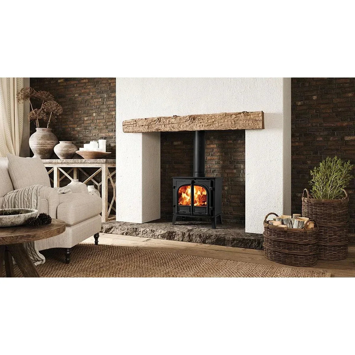 Wood burning stove with black metal finish set in rustic brick fireplace, cosy living room