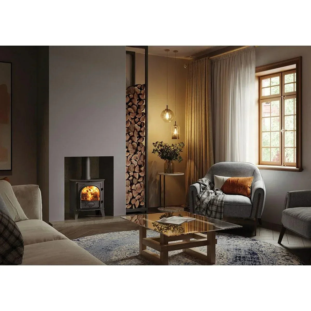 Modern living room with grey armchair, glass coffee table, log burner and wood storage
