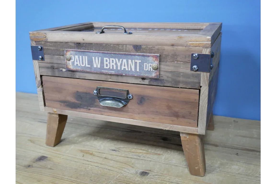 Rustic wooden storage box with metal handle, front drawer and street sign accent