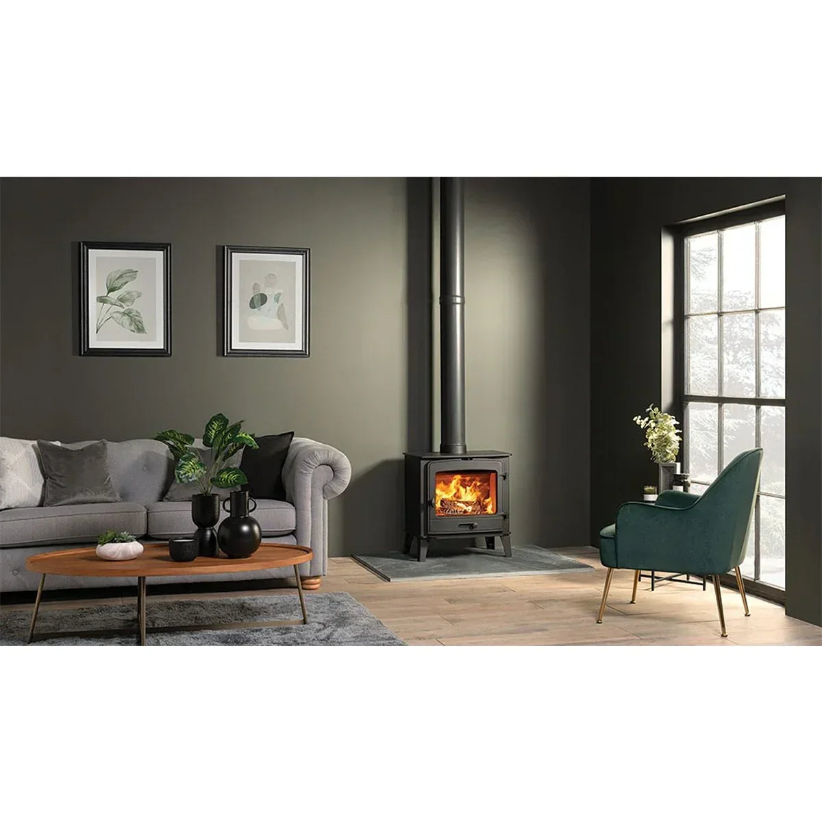 Contemporary living room with wood burning stove, grey sofa, and teal accent chair