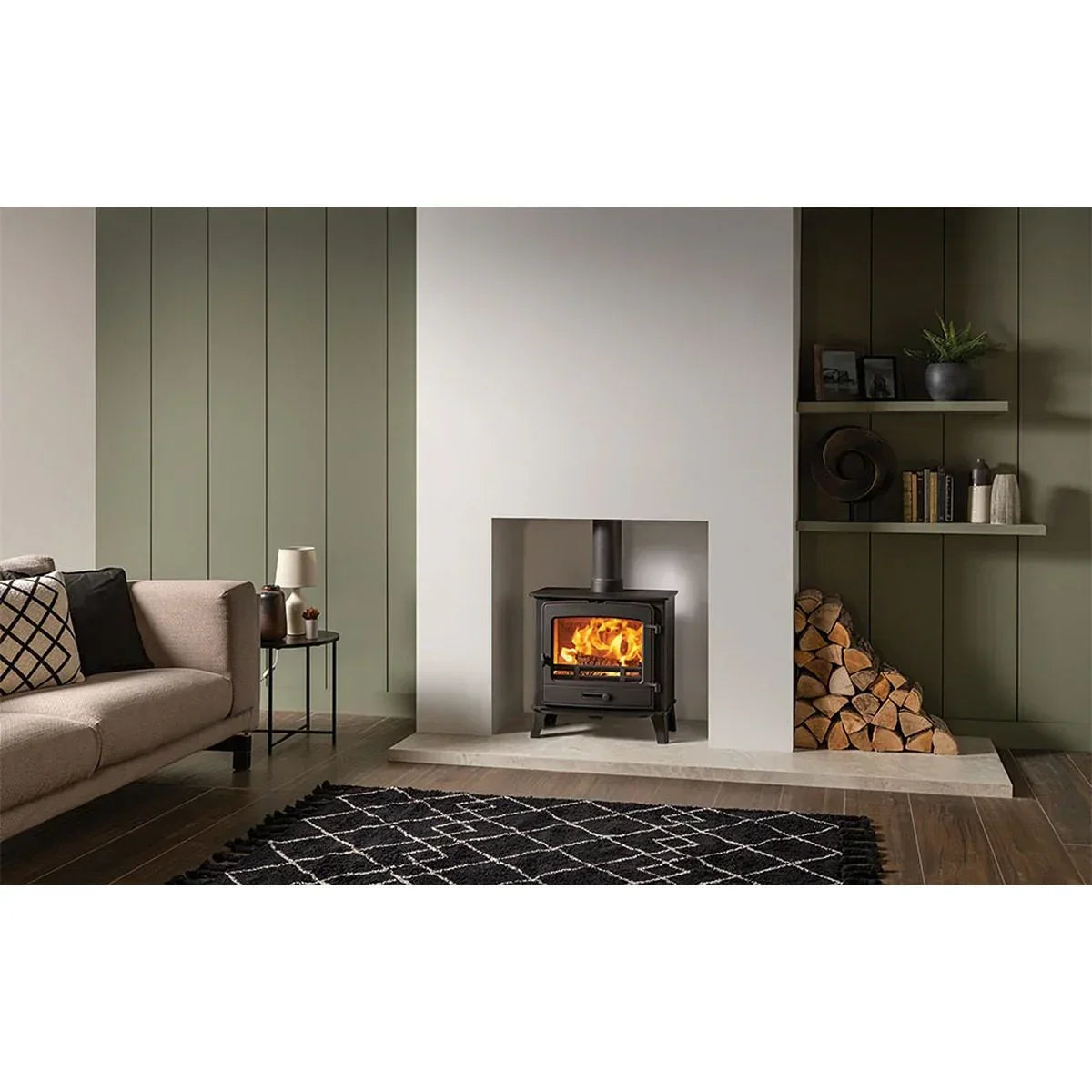Modern wood burning stove with stacked logs in contemporary living room setting