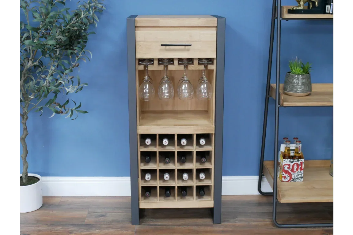 Wooden wine rack cabinet with glass holder and storage for bottles against blue wall