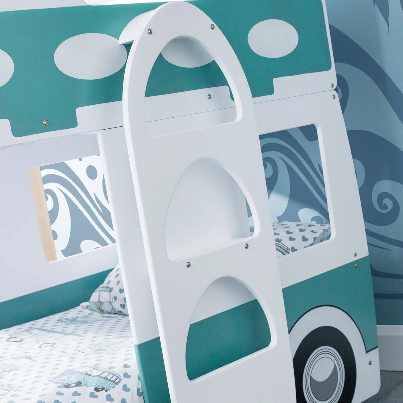 Kids camper van bunk bed with white ladder and teal accents in a themed bedroom