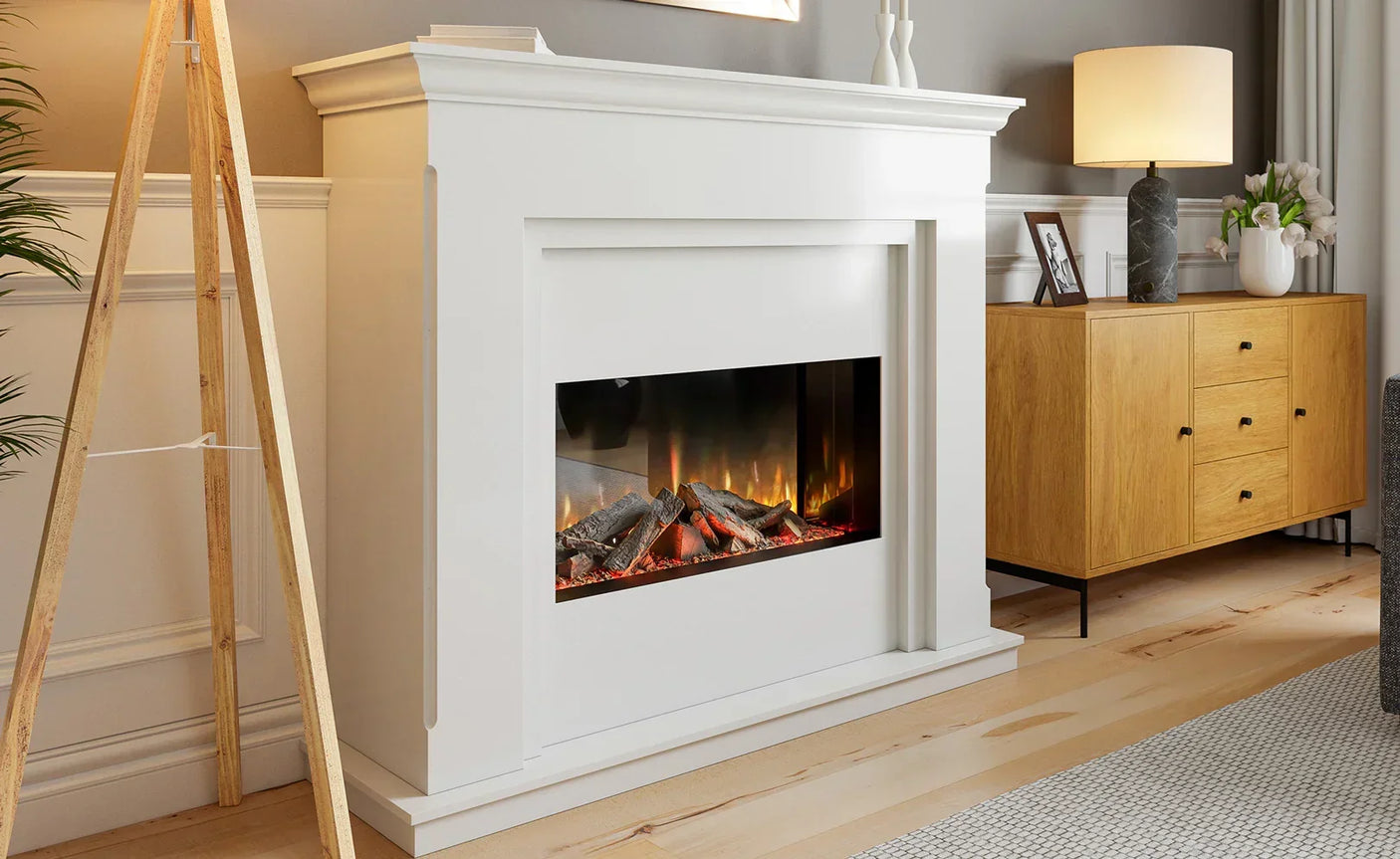 White electric fireplace suite with realistic log burner in modern living room