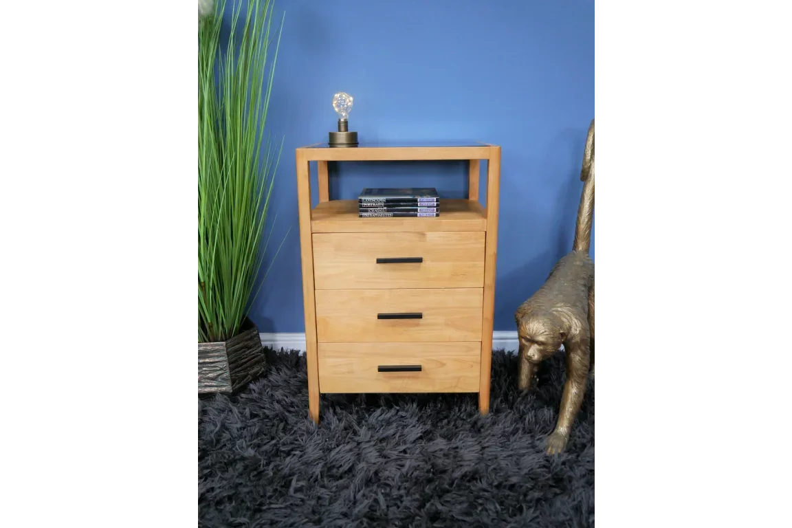 Oak bedside table with three drawers and open shelf on grey rug, books on top