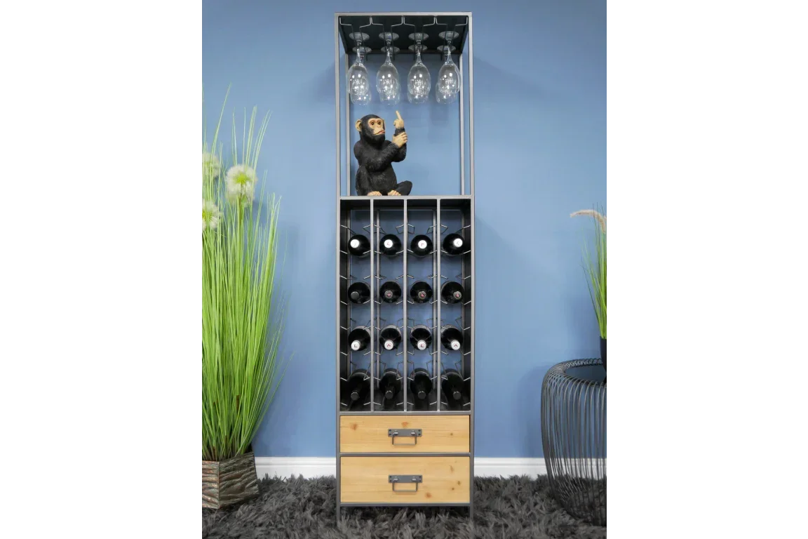 Tall wine rack with glass holder and drawers, filled with bottles, against blue wall
