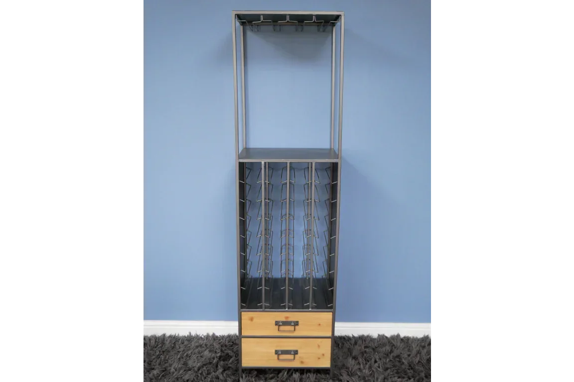 Tall metal wine rack with bottle slots and two wooden storage drawers against blue wall