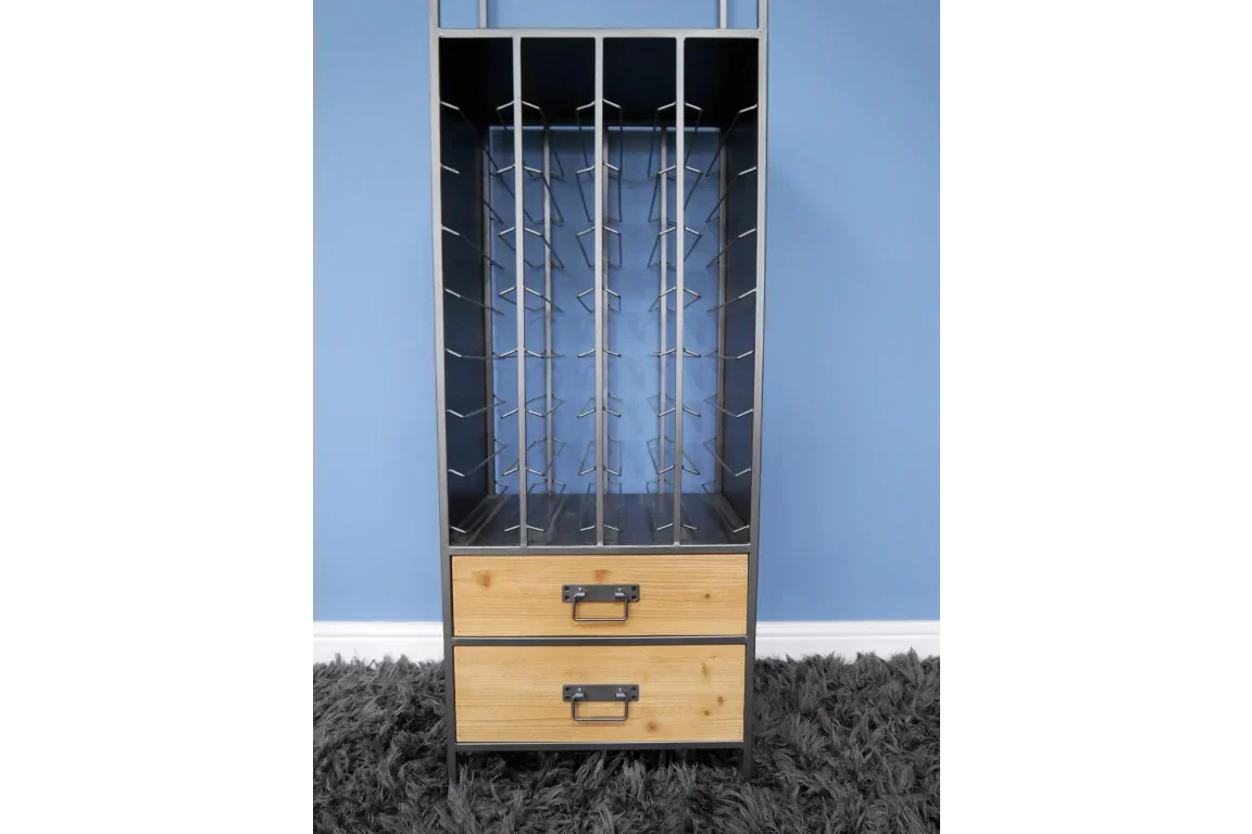 Metal and wood wine rack cabinet with two drawers against blue wall on grey rug