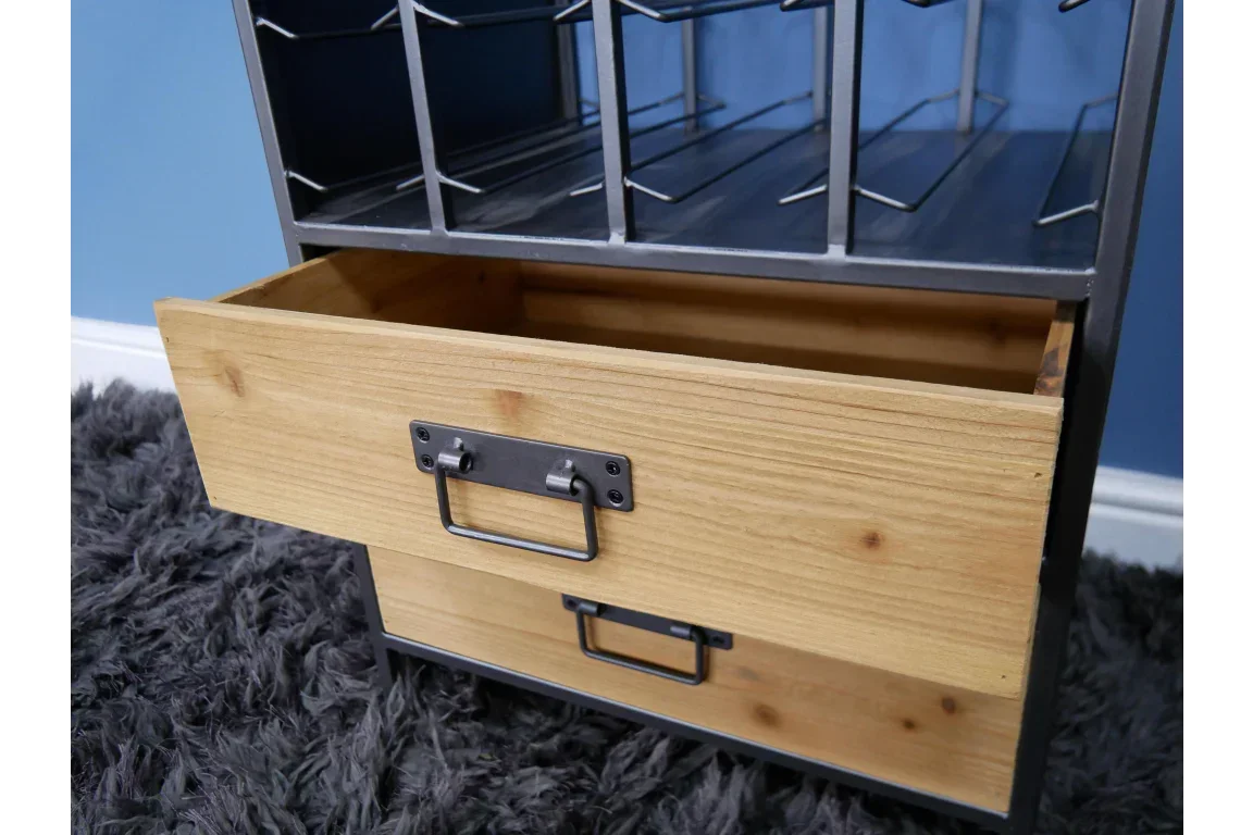 Wooden storage unit drawer with metal handles, metal shelving above on grey rug