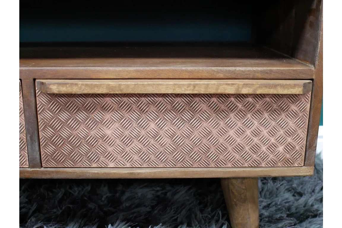 Textured wooden furniture drawer front with geometric pattern and angled leg