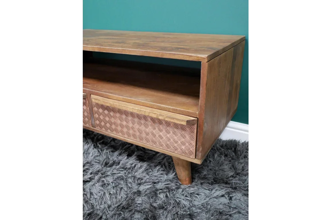 Mid-century wooden TV unit with open shelf and textured drawer front on grey rug