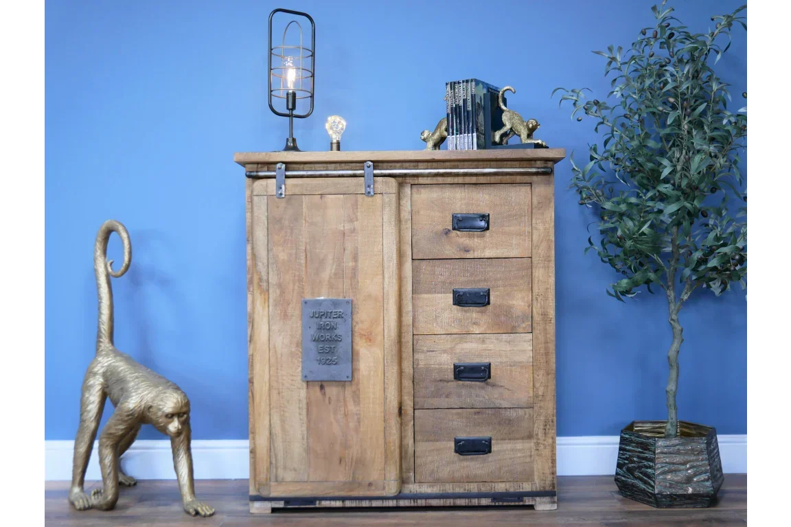Industrial wood sideboard with sliding door and four drawers against blue wall