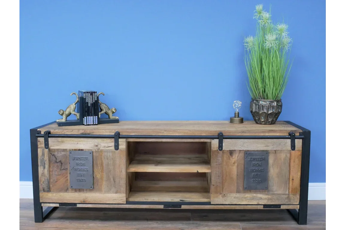 Industrial wood and metal TV unit with sliding doors, open shelves, and decorative accents