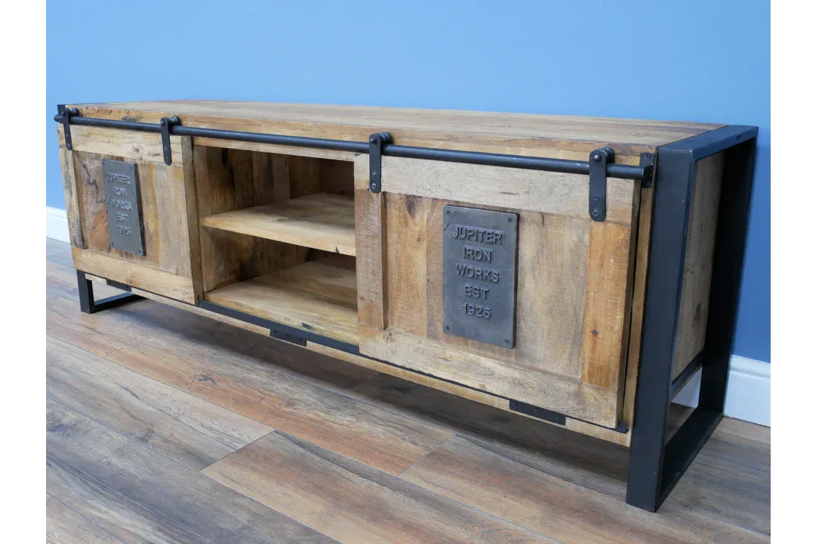 Industrial TV unit with sliding doors, open shelving and metal frame on wooden floor