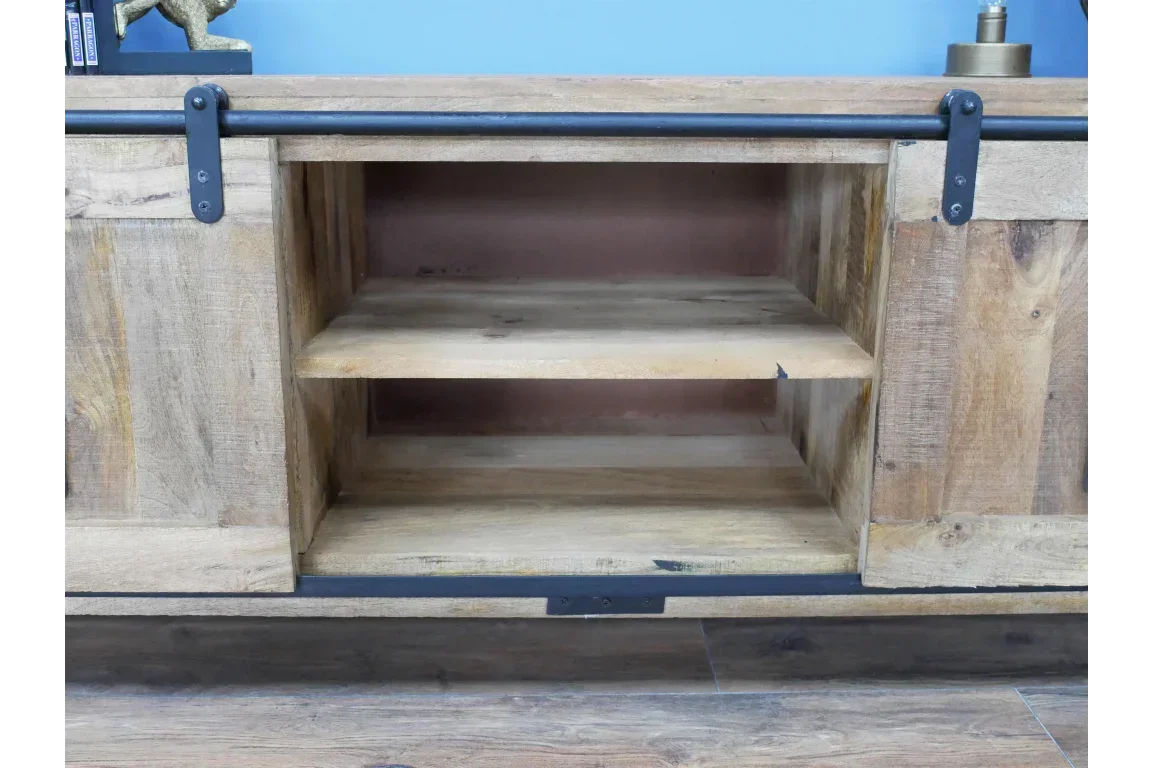 Rustic wooden TV unit with sliding barn doors and two open shelves