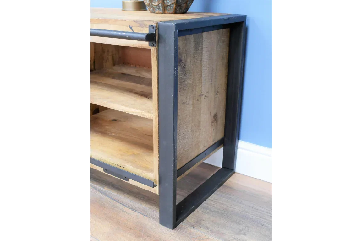 Industrial TV unit with black metal frame and natural wood shelves against blue wall
