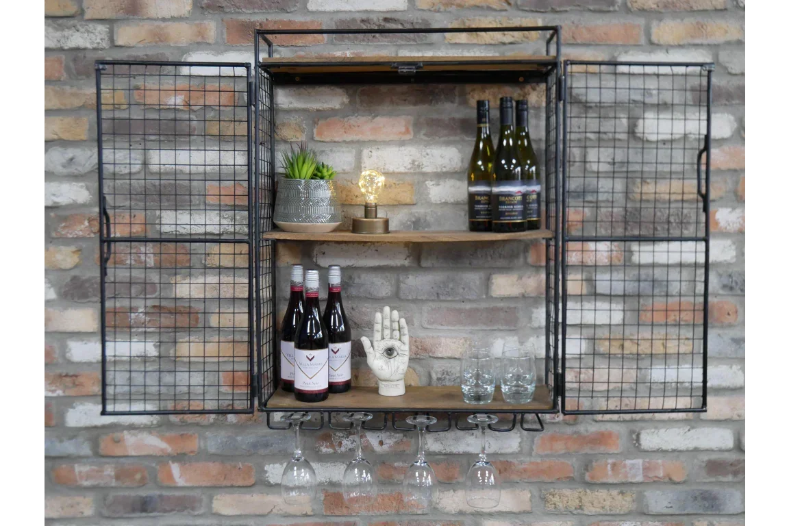 Industrial metal wall wine rack with shelves, bottles, glasses, and decor against brick wall