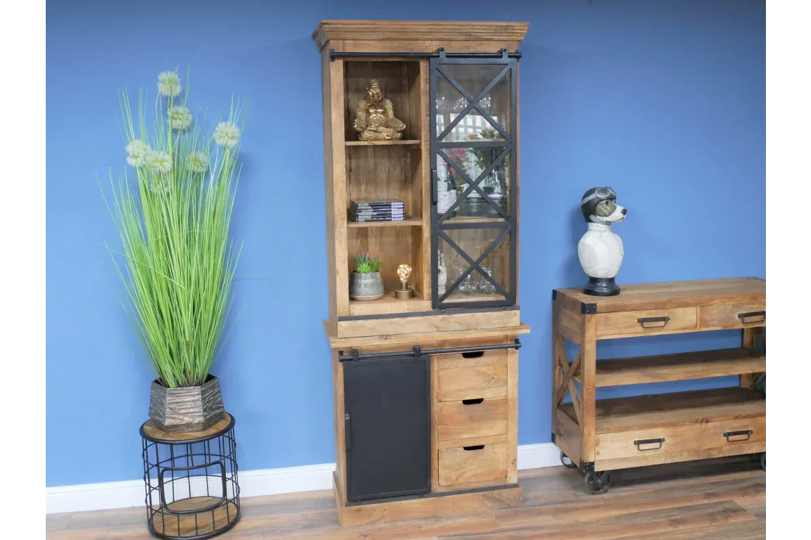 Wooden display cabinet with glass door, black sliding panel, and storage drawers