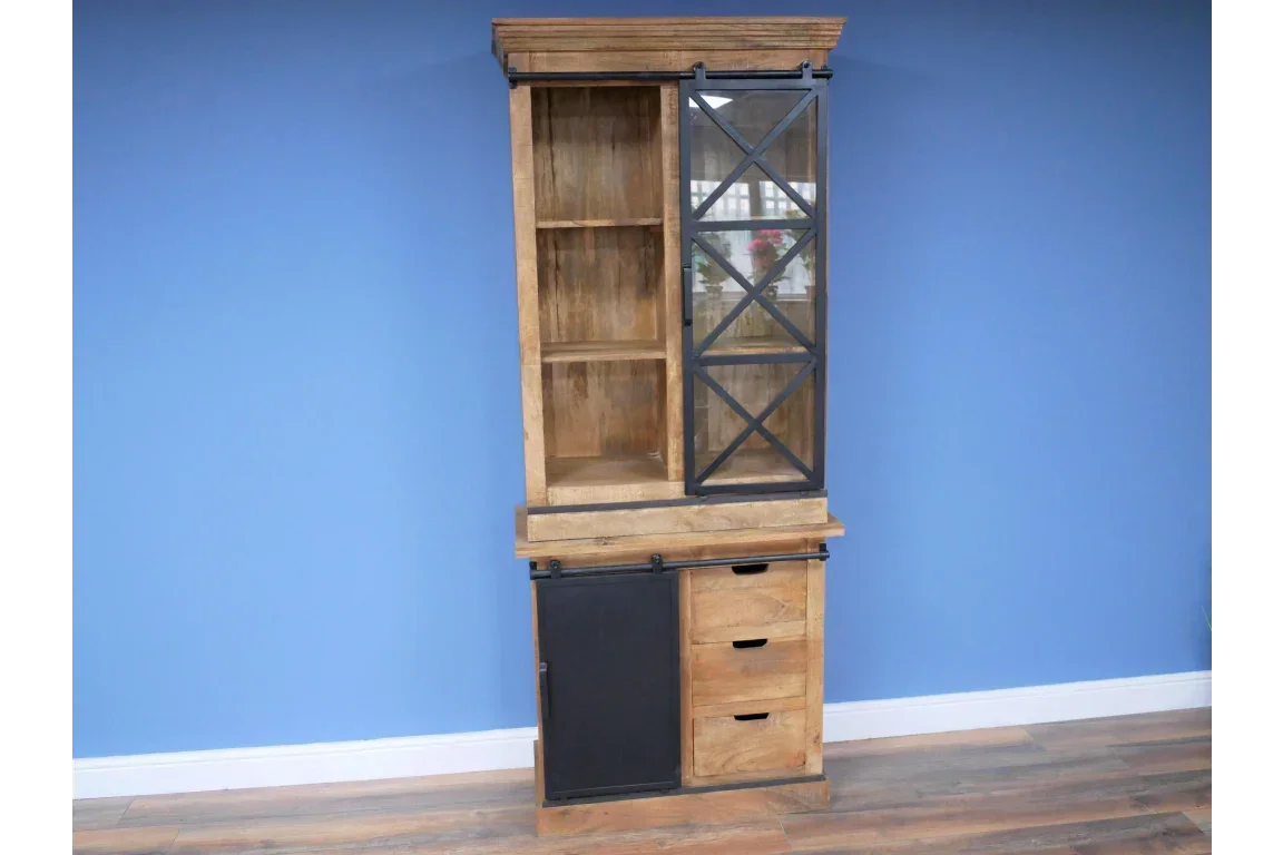 Wooden display cabinet with glass sliding door, three drawers and black metal accents