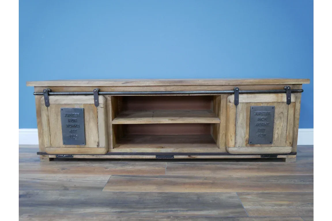 Industrial wood TV unit with sliding doors and metal plates, two open shelves, blue wall