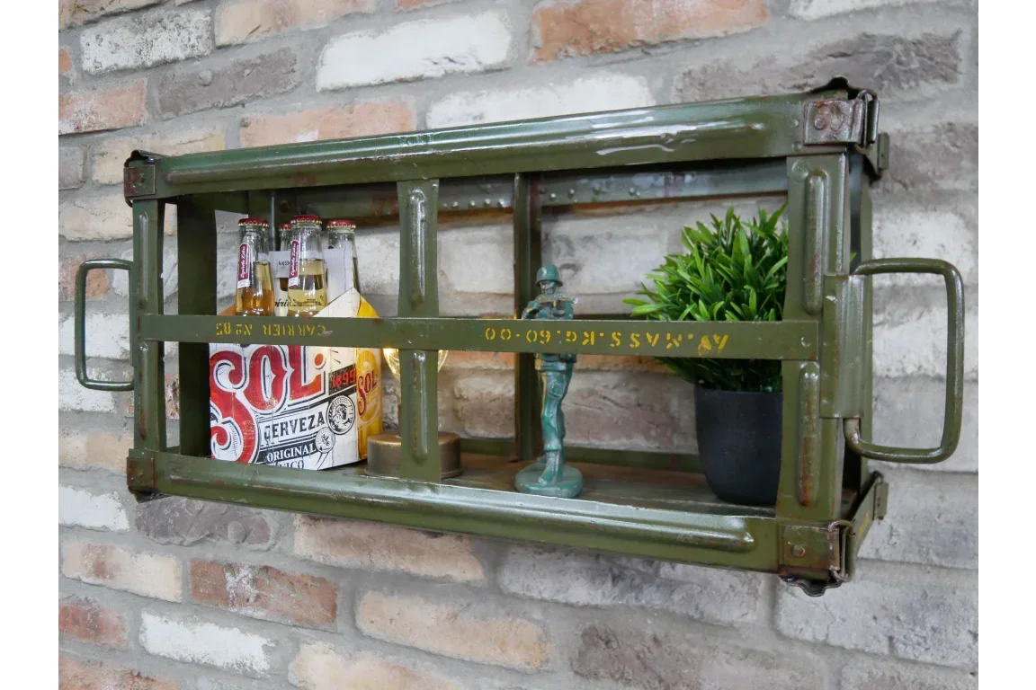 Industrial metal wall shelf with green finish, bottles, small plant and ornament on display