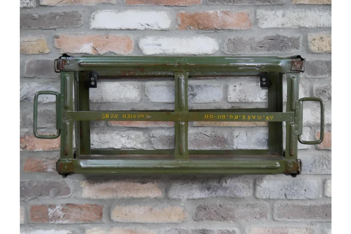 Green metal wall shelf with handles mounted on exposed brick wall
