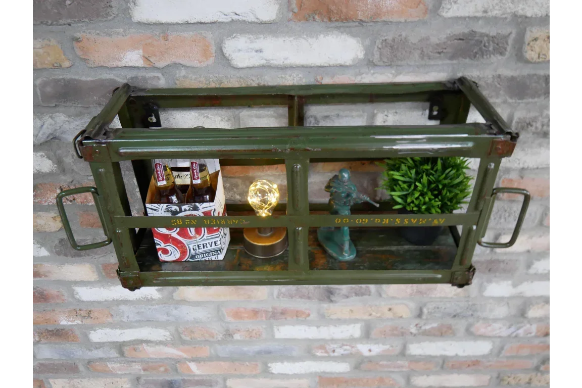 Green industrial wall shelf with drinks, lamp, figurine, and plant decor on brick background
