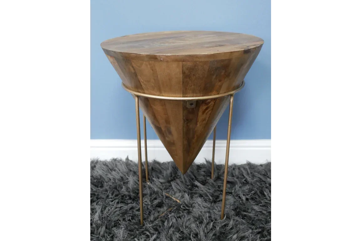 Wooden side table with tapered cone base and slim gold metal legs on grey rug
