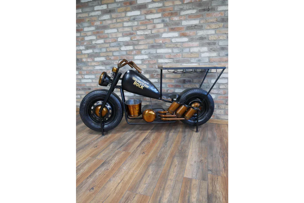 Black motorcycle shaped bar table with shelves and gold accents on wooden floor