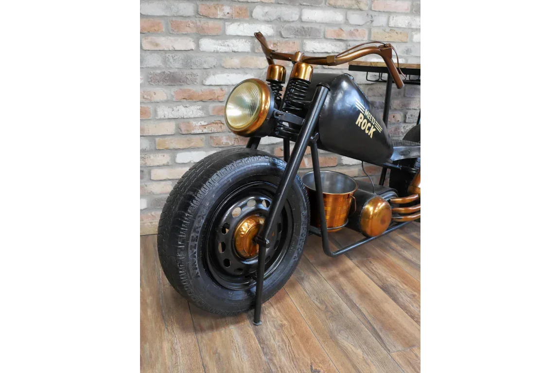 metal motorcycle-shaped bar table with front wheel, gold accents, and storage buckets